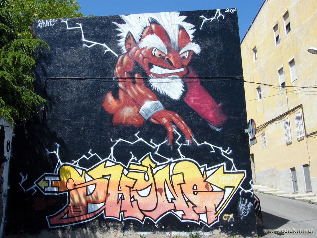 Барселона, граффити: обгоревший на солнце турист.